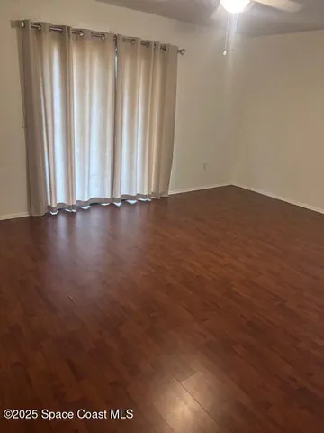 a view of wooden floor and staircase