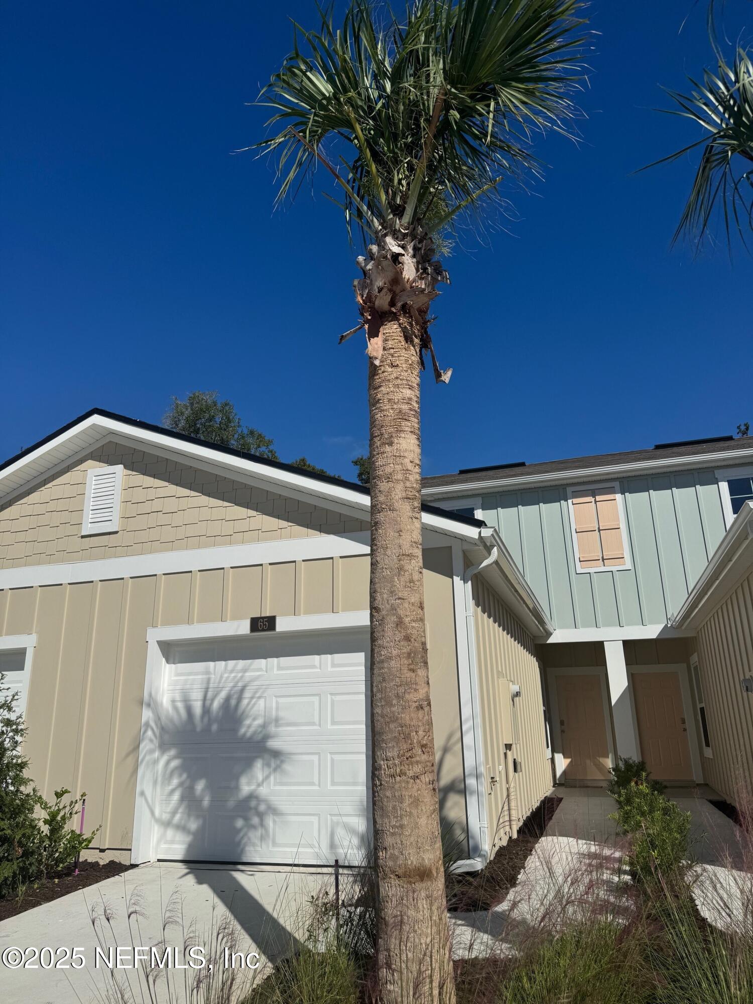 65 Blue Hvn Road St. Augustine, FL 32095 - Photo 1 of 57 a front view of a house with plants