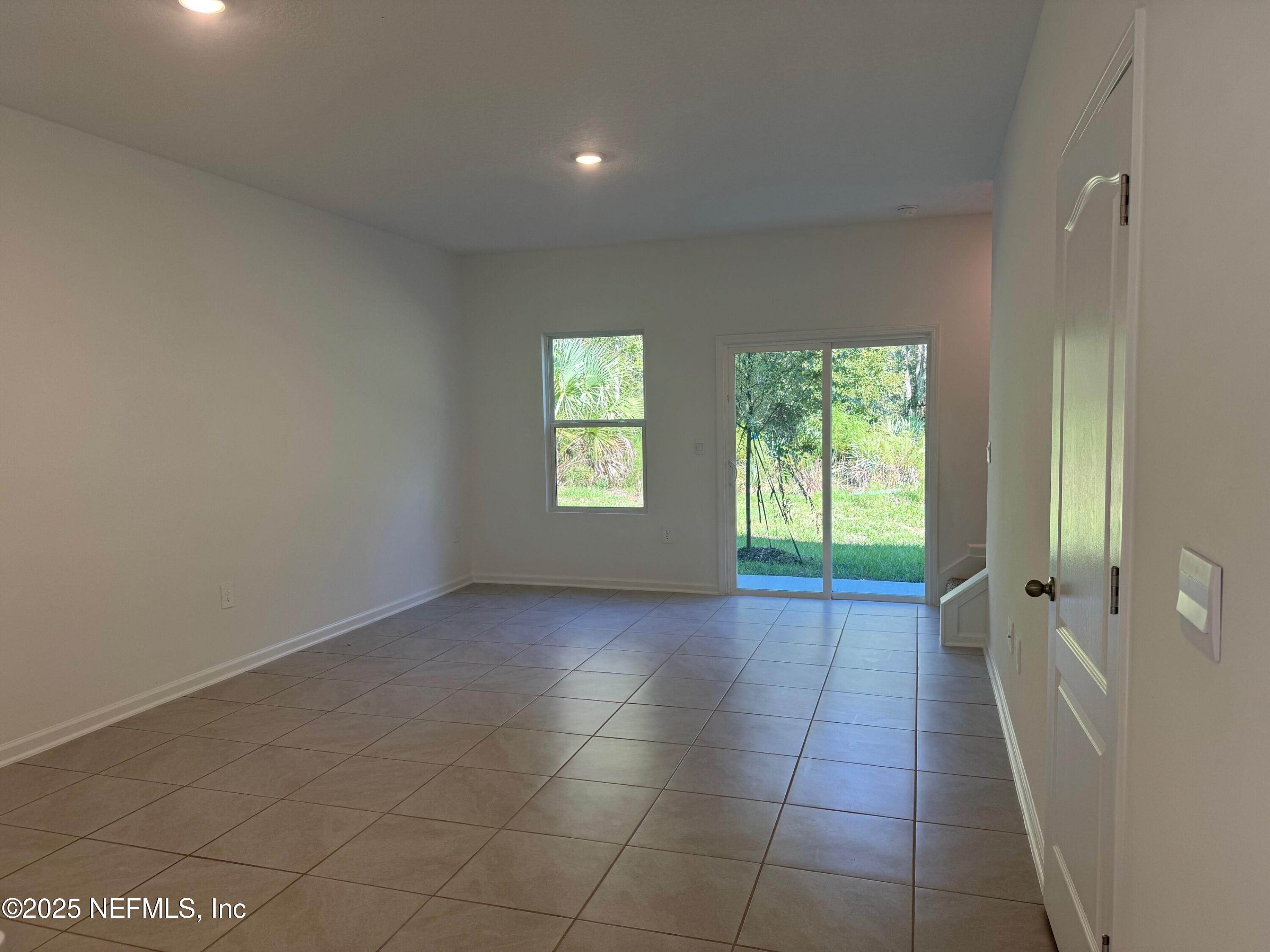65 Blue Hvn Road St. Augustine, FL 32095 - Photo 11 of 57 a view of an empty room with a window