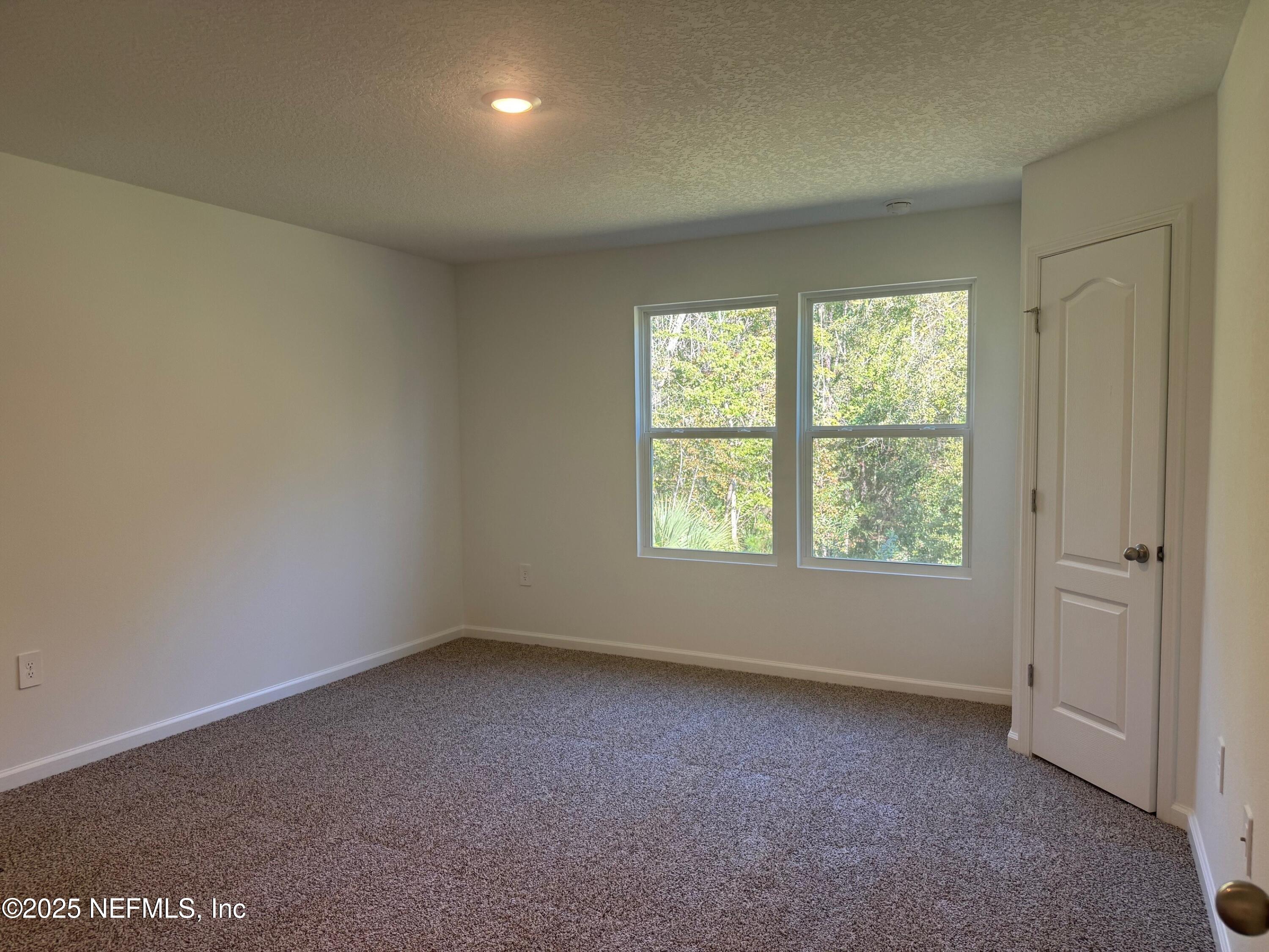 65 Blue Hvn Road St. Augustine, FL 32095 - Photo 16 of 57 an empty room with a window