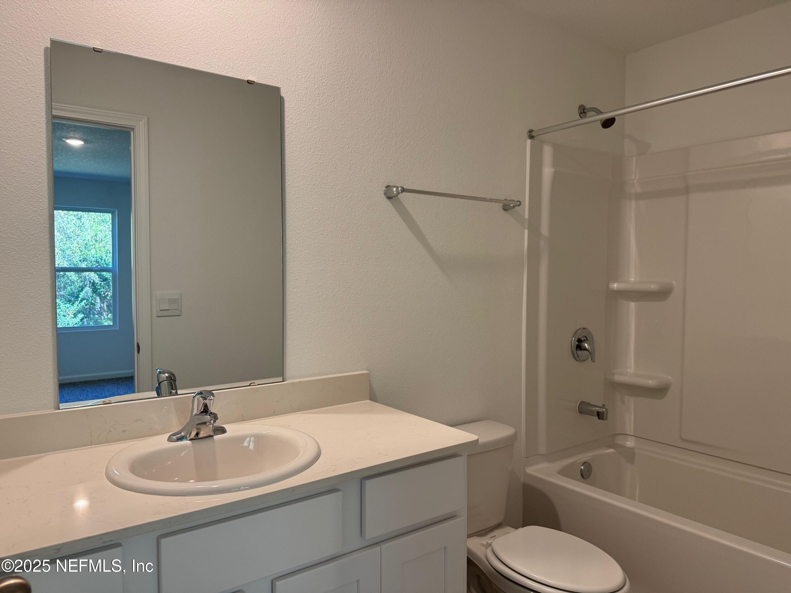 65 Blue Hvn Road St. Augustine, FL 32095 - Photo 19 of 57 a bathroom with a sink toilet and shower