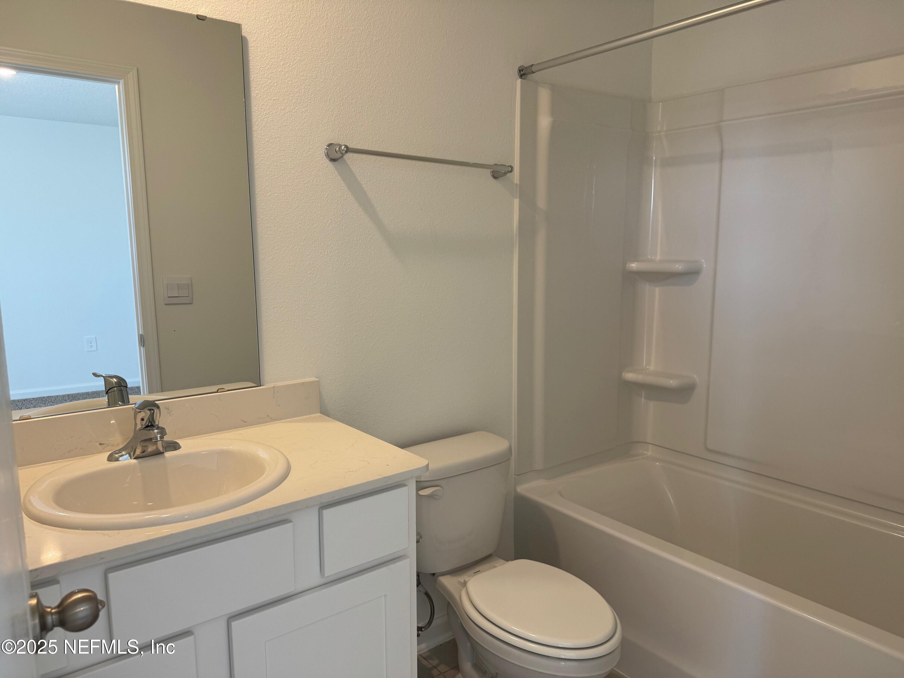 65 Blue Hvn Road St. Augustine, FL 32095 - Photo 23 of 57 a bathroom with a sink toilet and shower