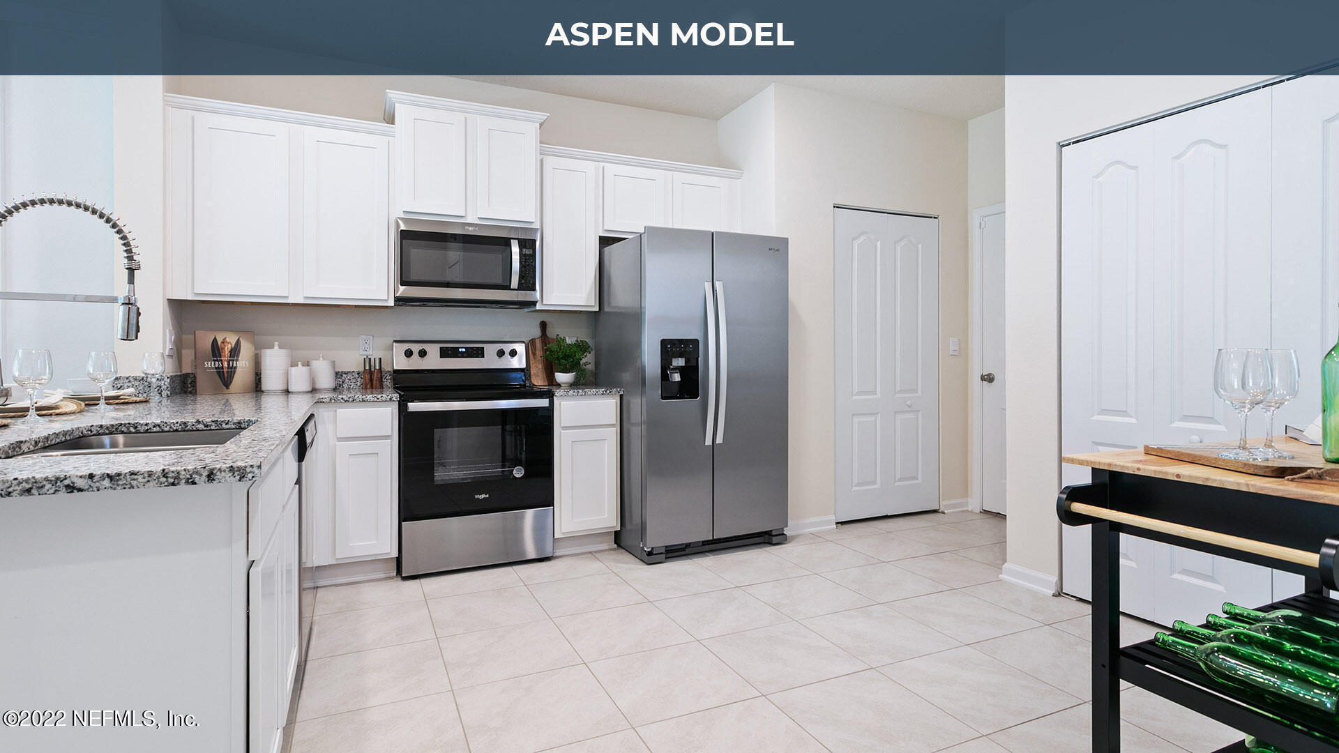 65 Blue Hvn Road St. Augustine, FL 32095 - Photo 8 of 57 a kitchen with stainless steel appliances granite countertop a stove refrigerator and a microwave