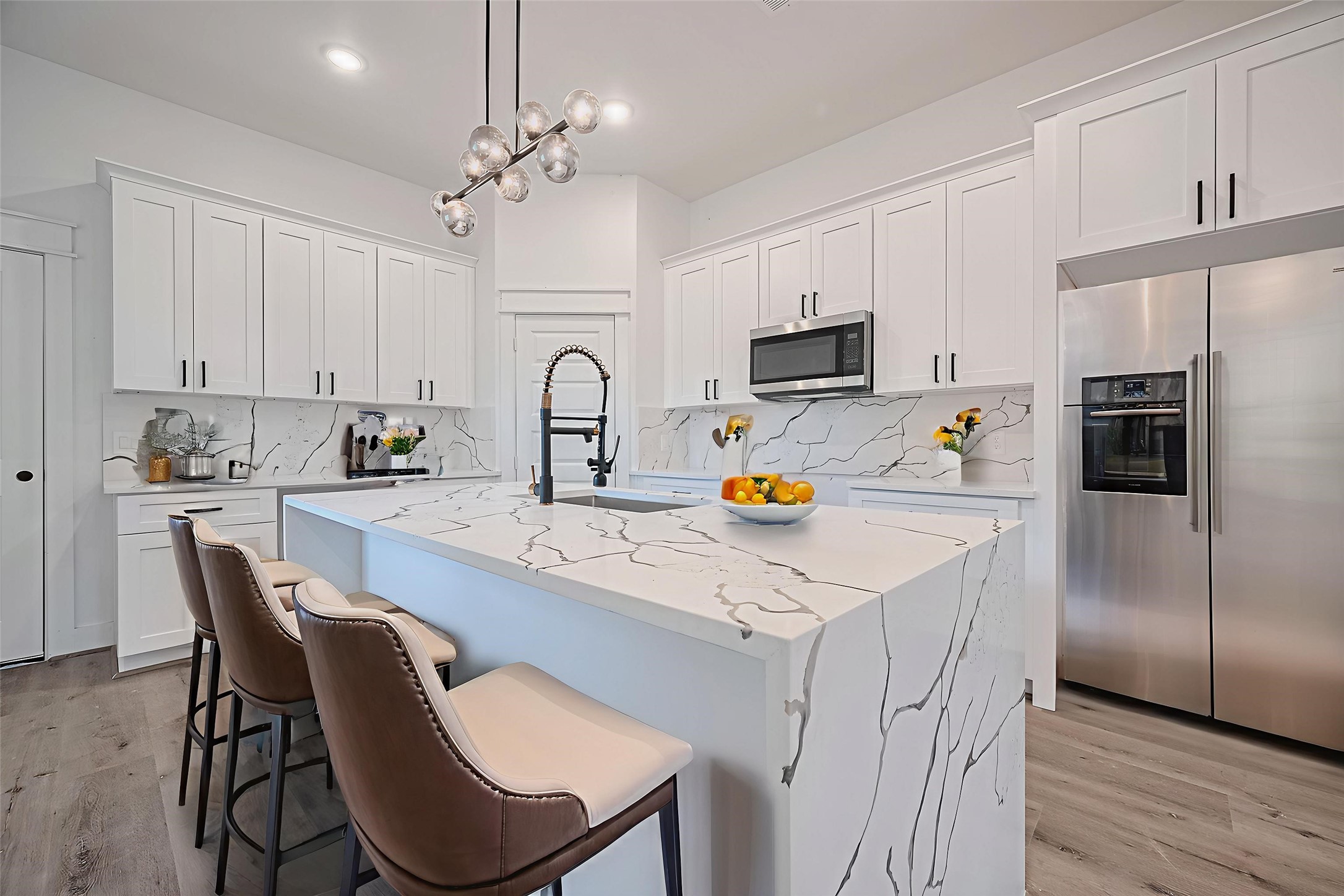 6747 Liverpool Street Houston, TX 77021 - Photo 15 of 18 The kitchen impresses with a large center island, single sink, and stunning granite countertops. This room has been virtually staged.