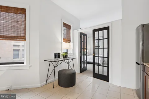 a view of a livingroom with furniture and windows