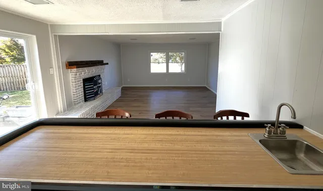 a kitchen with a sink and a window