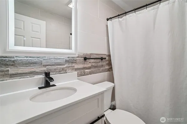 a view of a hallway with washer and dryer