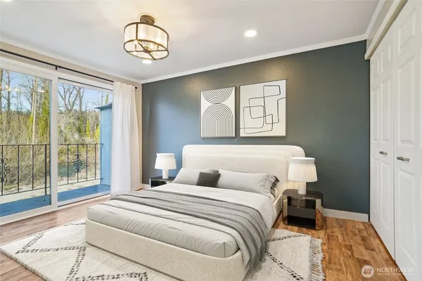 a bedroom with a large bed and a window