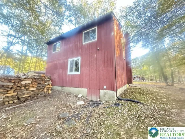 a view of a backyard of the house