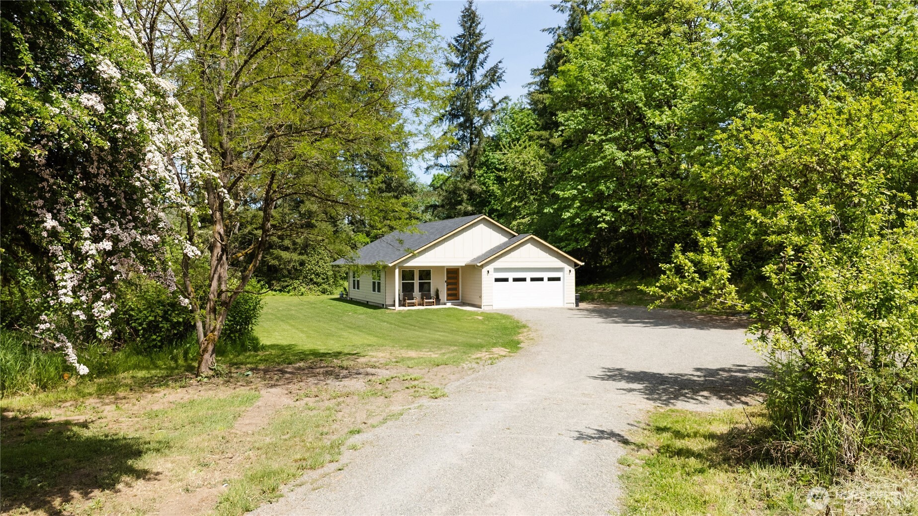 111 Eadon Road Toledo, WA 98591 - Photo 1 of 32 a view of house with a yard and large trees