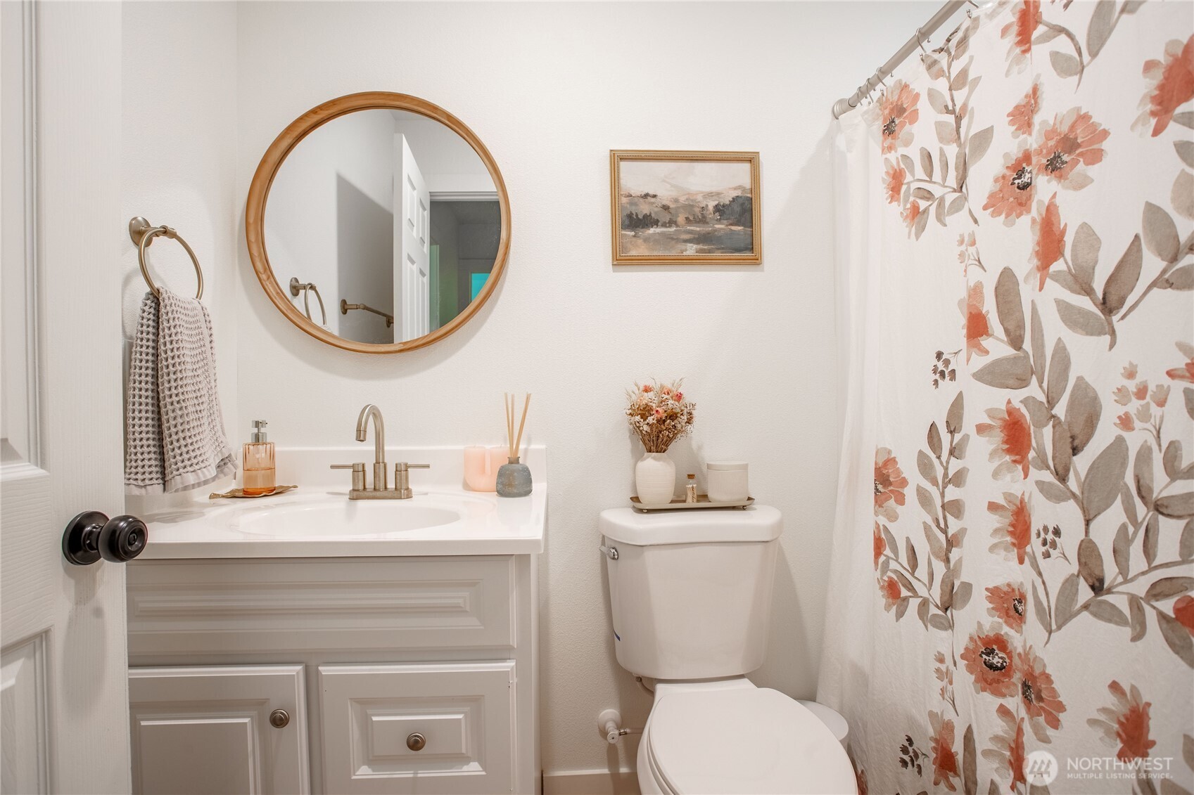 111 Eadon Road Toledo, WA 98591 - Photo 15 of 32 a bathroom with a toilet sink vanity and mirror