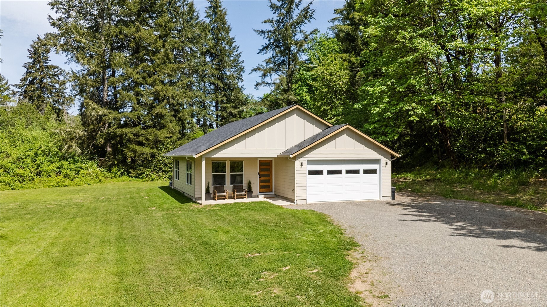 111 Eadon Road Toledo, WA 98591 - Photo 2 of 32 a view of a house next to a yard with large trees