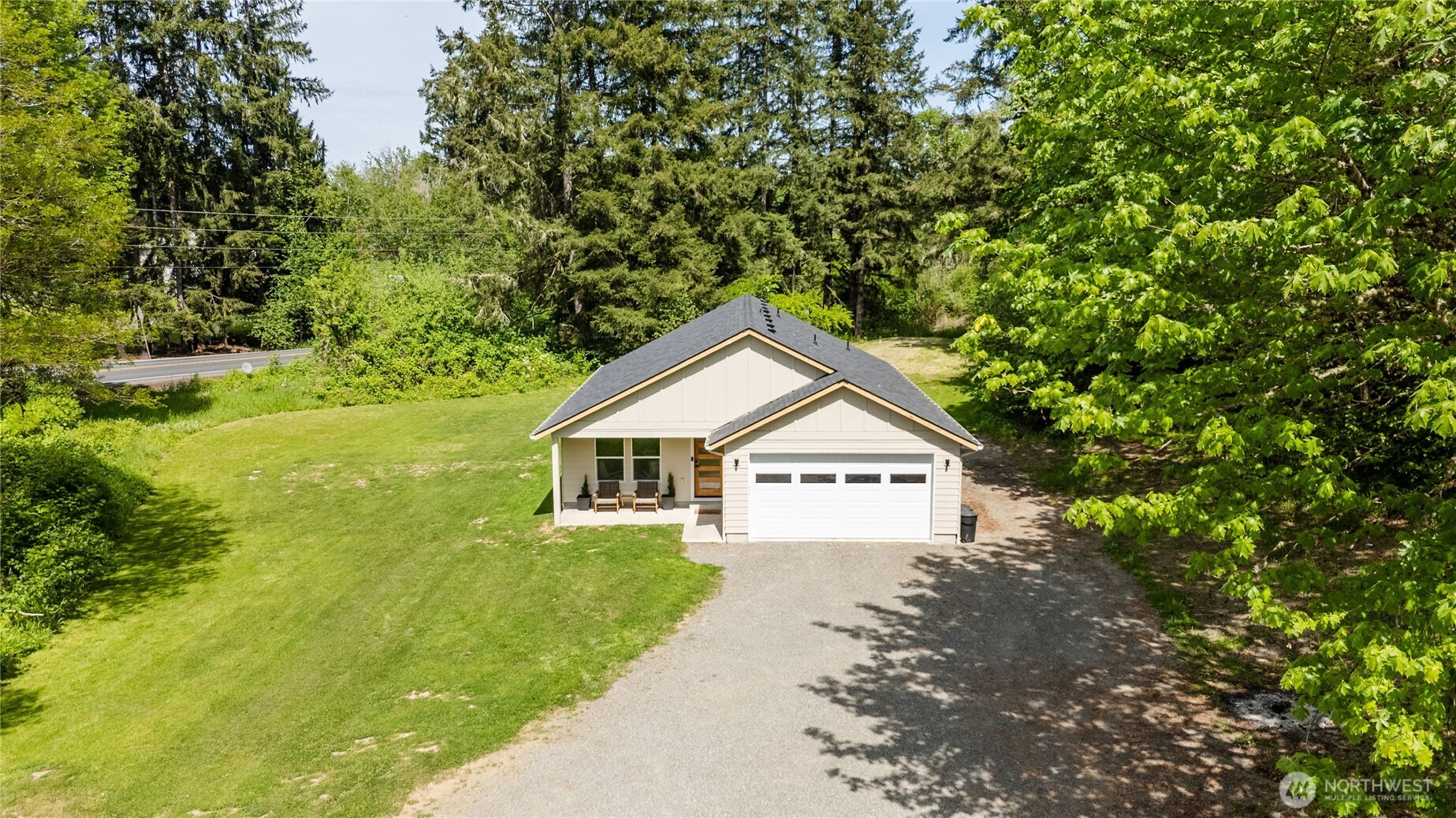 111 Eadon Road Toledo, WA 98591 - Photo 26 of 32 a view of a house with a small yard and large trees
