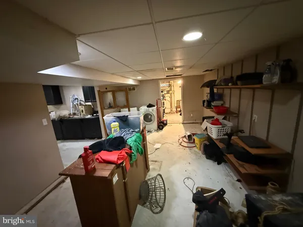 a room with furniture a couch and a window