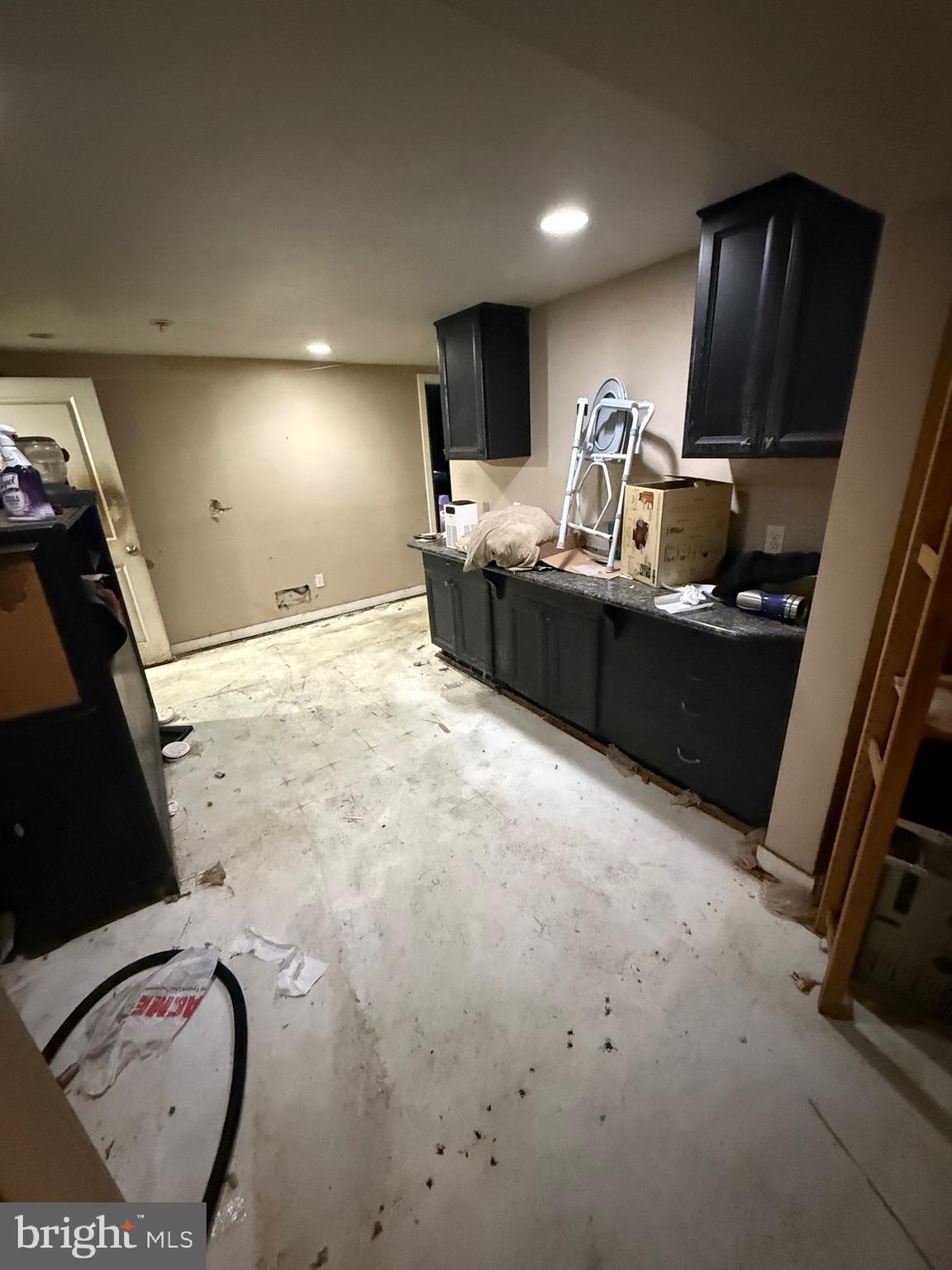 1602 Harvey Road Wilmington, DE 19810 - Photo 17 of 34 a kitchen with stainless steel appliances a sink a stove a refrigerator cabinets and a dining table