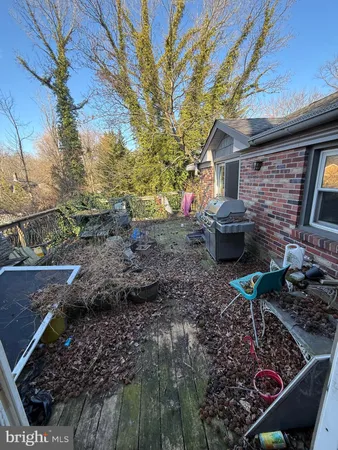 a backyard of a house with barbeque oven