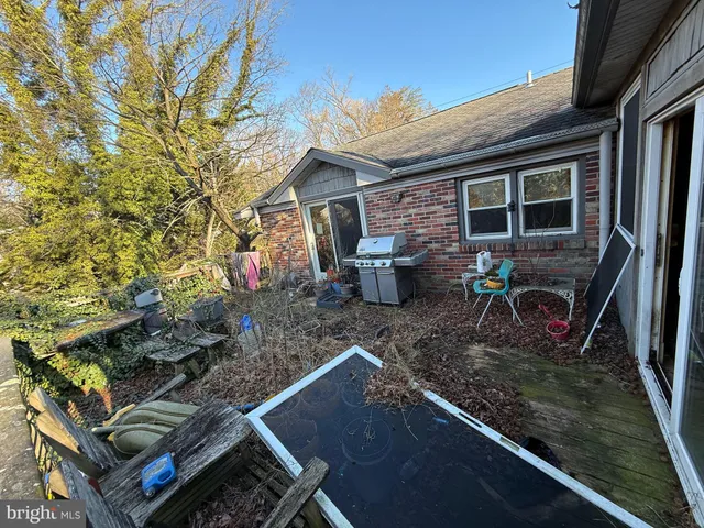 a view of a backyard with sitting area