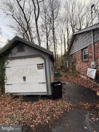 a view of a wooden house with a yard