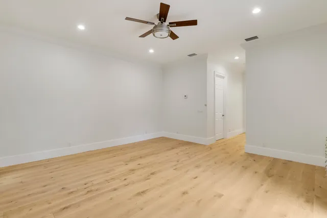 a bathroom with a double vanity sink mirror and shower