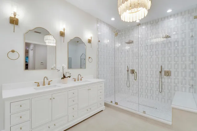 a bathroom with a double vanity sink and a mirror