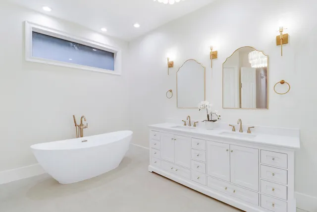 a utility room with sink dryer and washer