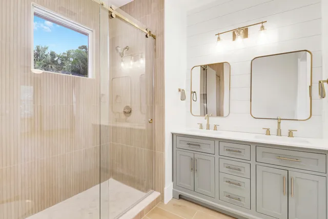 a view of a room with a sink and chandelier