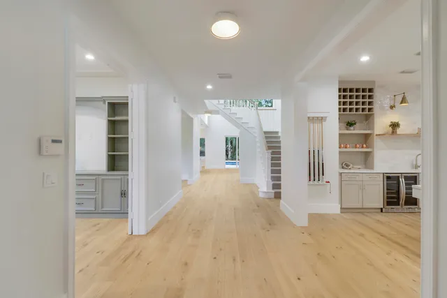 a room with pool table and a window