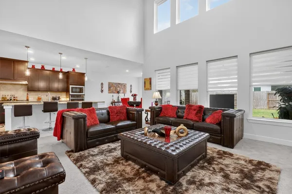 a living room with furniture and a rug