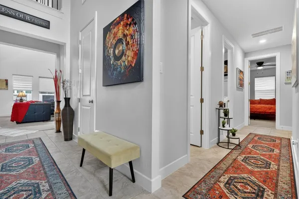 a bedroom with furniture and a rug