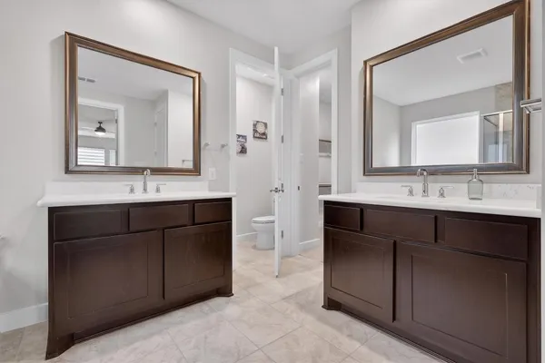 a bathroom with a granite countertop sink mirror and double