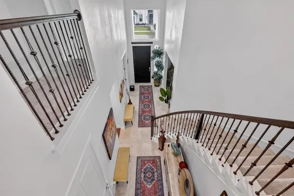 a view of staircase with wooden floor and stairs