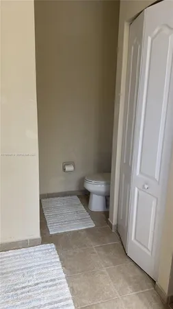 a view of a toilet in a bathroom