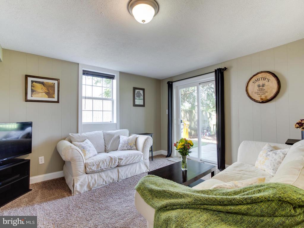 132 Oakwood Road Edgewater, MD 21037 - Photo 22 of 37 a living room with furniture and window