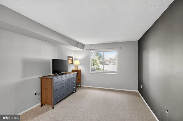 a living room with furniture and flat screen tv