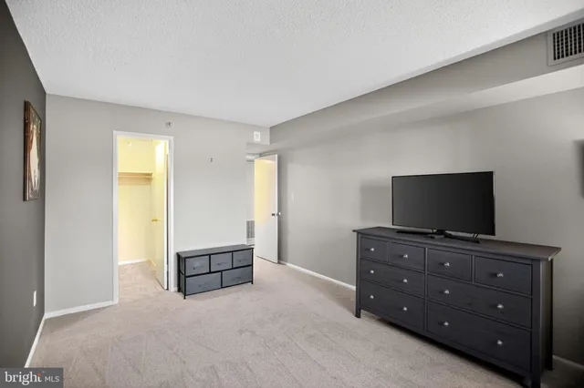 a living room with furniture and flat screen tv