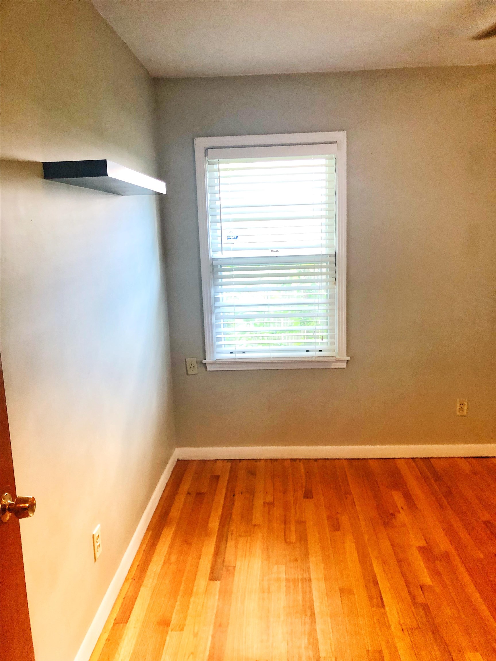 1629 Rabb Road Memphis, TN 38119 - Photo 7 of 21 a view of a room with wooden floor and a window