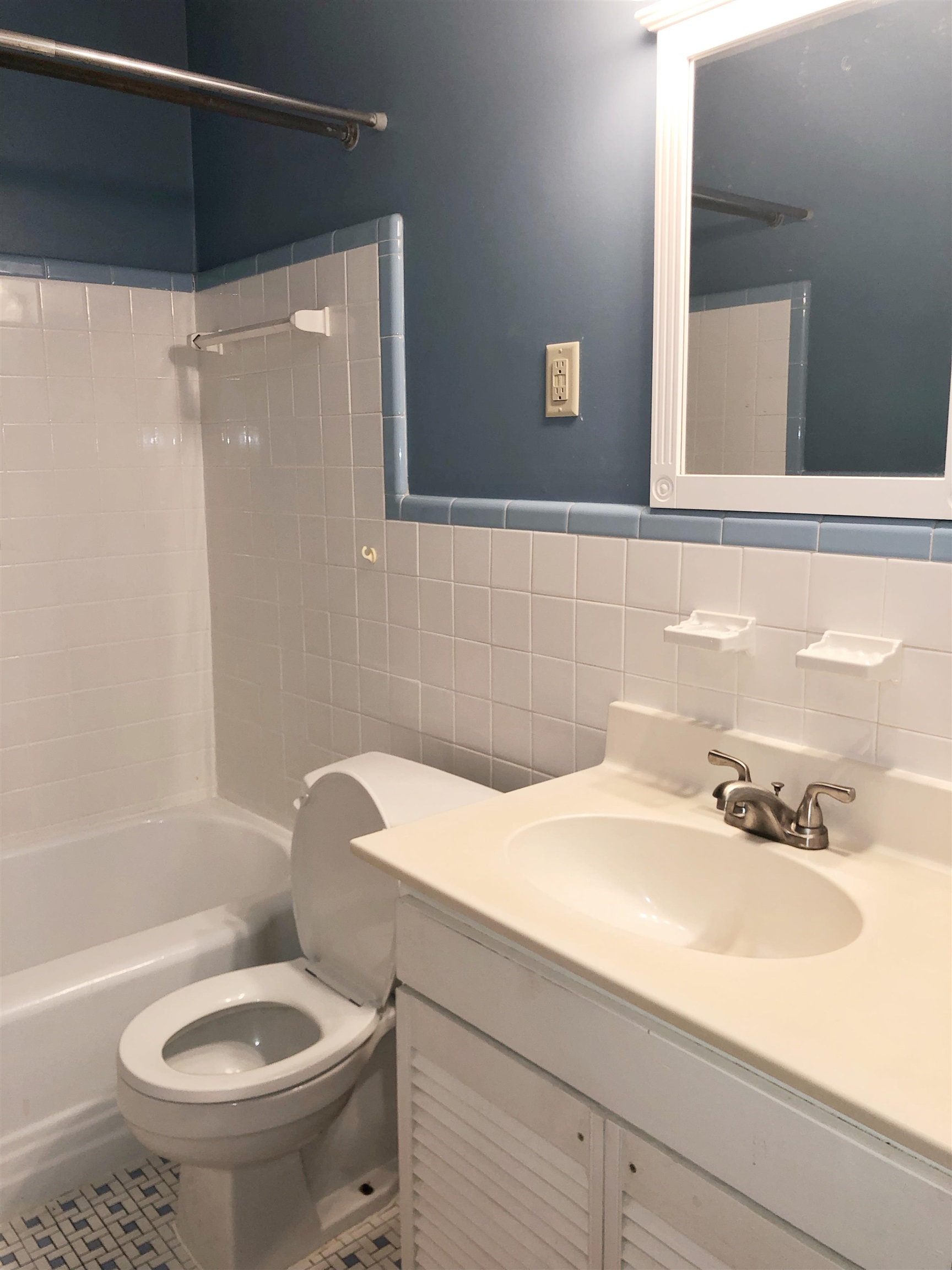 1629 Rabb Road Memphis, TN 38119 - Photo 9 of 21 a bathroom with a sink a toilet and shower