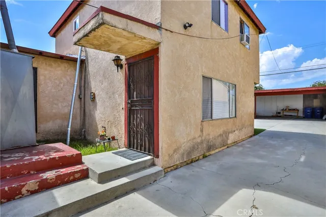 a view of a livingroom with furniture and staircase