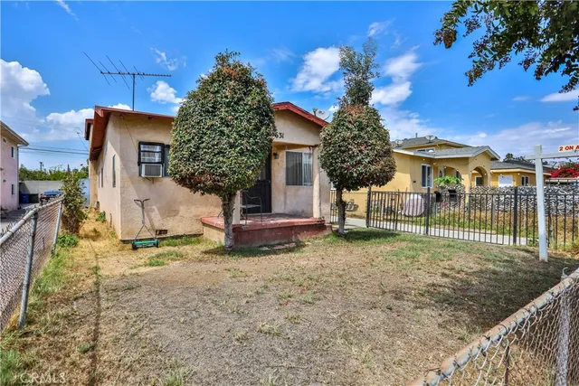 front view of a house with a yard