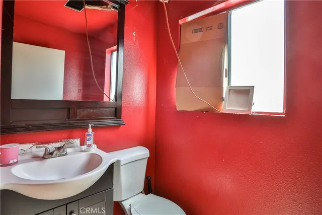 a room with a window and ceiling fan