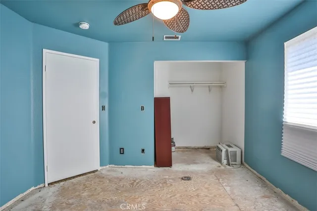 a bathroom with a sink a toilet and shower curtain