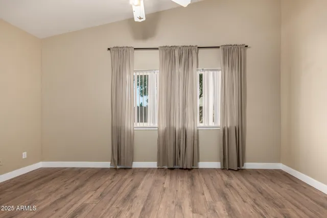 a view of a house with backyard and porch