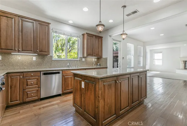a view of an empty room with a fireplace