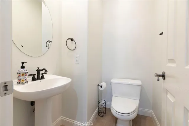 a view of staircase with wooden floor and a chandelier