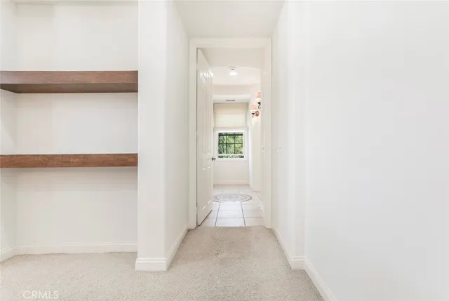 a spacious bathroom with a double vanity sink a mirror and a shower