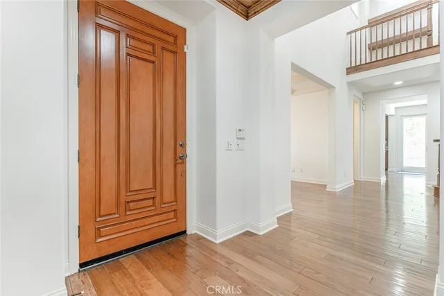 a view of an empty room with a fireplace and a window