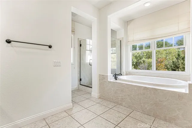 a view of a backyard with sitting area and garden