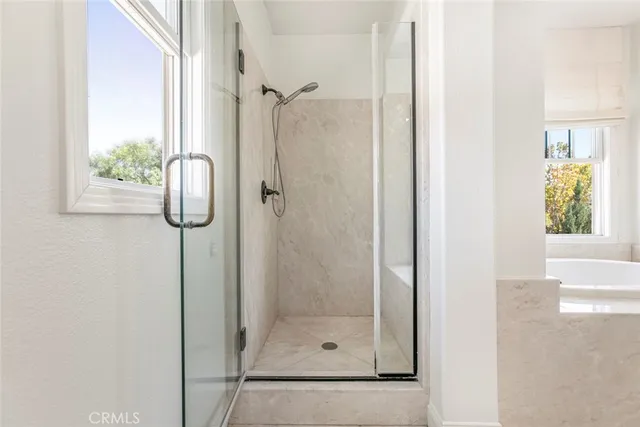 a view of backyard with table and chairs and potted plants