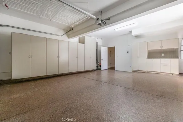 an aerial view of residential house and sandy dunes