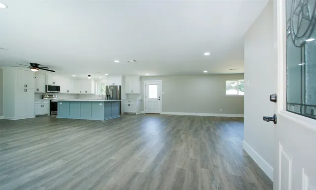 a view of kitchen and kitchen with wooden floor